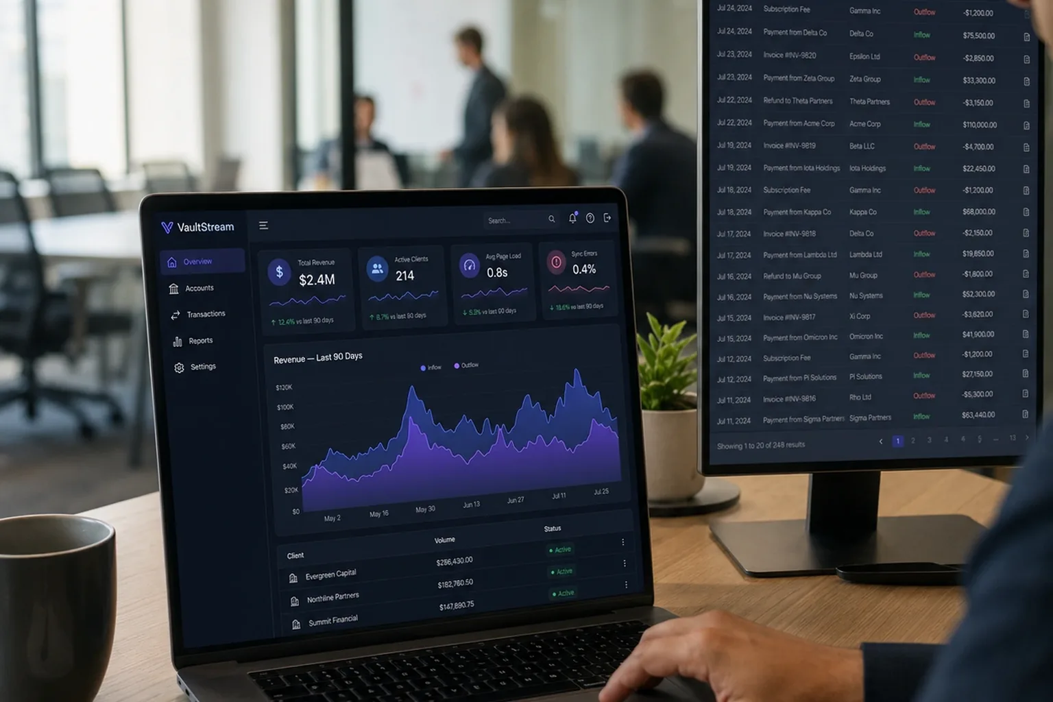 Analyst reviewing the VaultStream dashboard on a laptop in a fintech office
